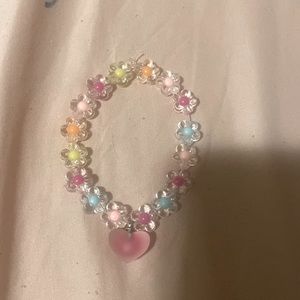 This product is a one piece bracelet with multi-color flower charms and a heart.